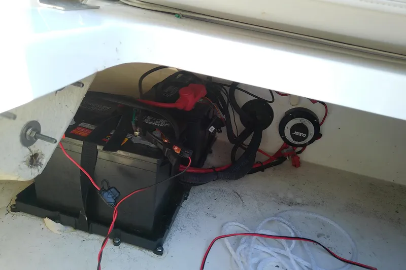 Slide: The Image of Battery compartment of 2021 Hurricane SunDeck 2410 OB with wiring and connections. - 26