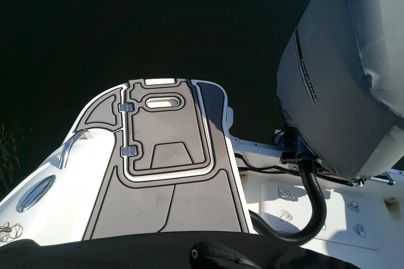 Slide: The Image of 2021 Hurricane SunDeck 2410 OB boat deck and engine cover. - 32