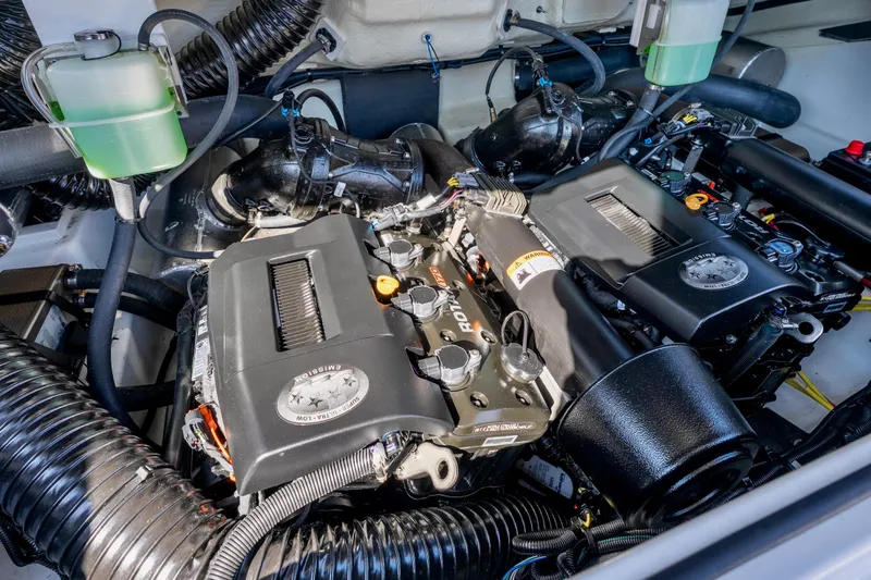 Slide: The Image of 2024 Scarab 235 ID engine compartment with dual motors and cooling systems. - 14