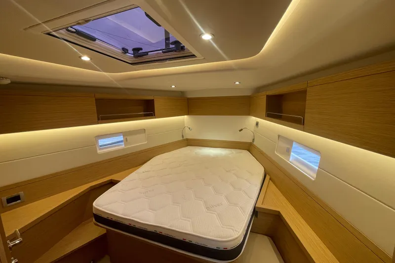 Slide: The Image of Luxurious cabin interior of 2026 Grand Soleil 42 Long Cruise yacht, featuring a comfortable bed. - 18