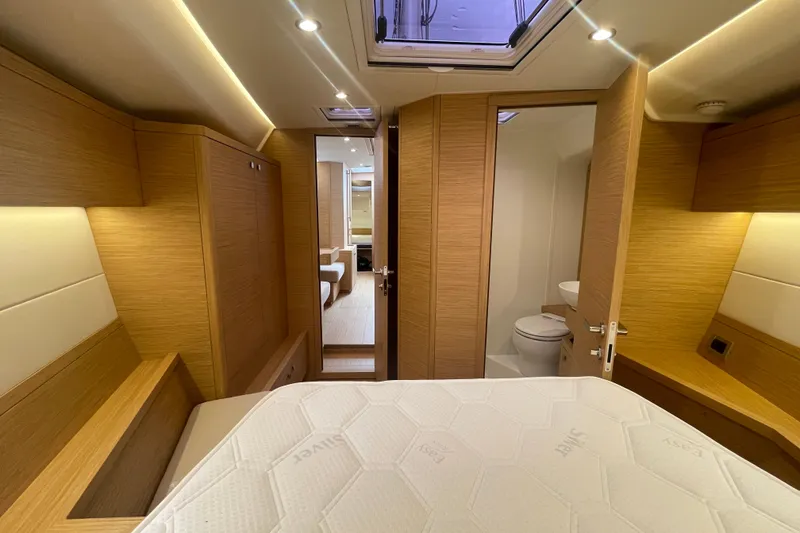 Slide: The Image of Luxurious interior of 2026 Grand Soleil 42 Long Cruise yacht cabin with modern wood finish. - 19