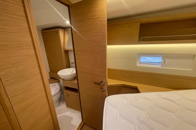Slide: The Image of Interior of 2026 Grand Soleil 42 Long Cruise yacht, featuring modern wood finish and compact bathroom. - 20