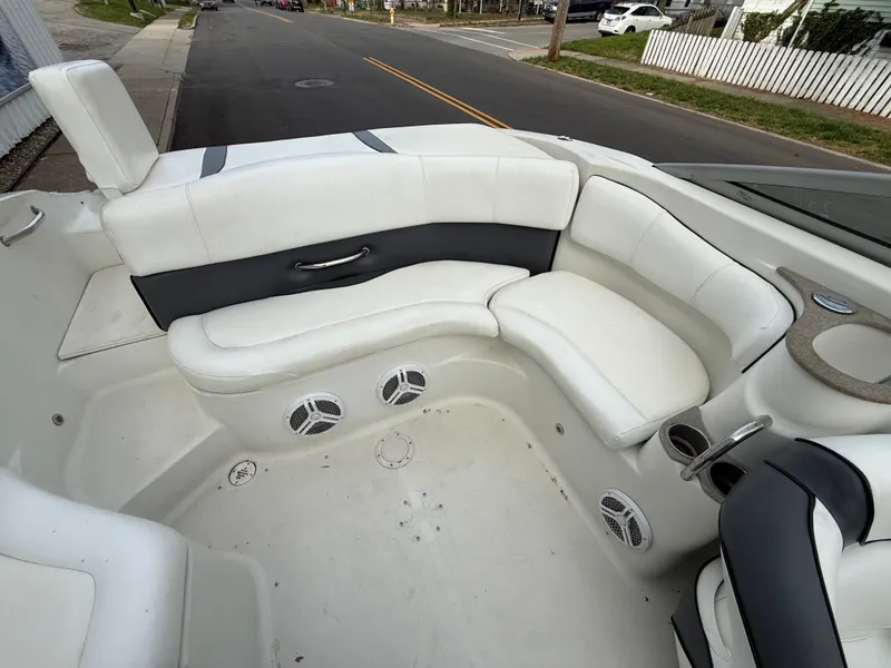 Slide: The Image of Interior of a 2007 Caravelle 237 LS Bowrider with white seating. - 11