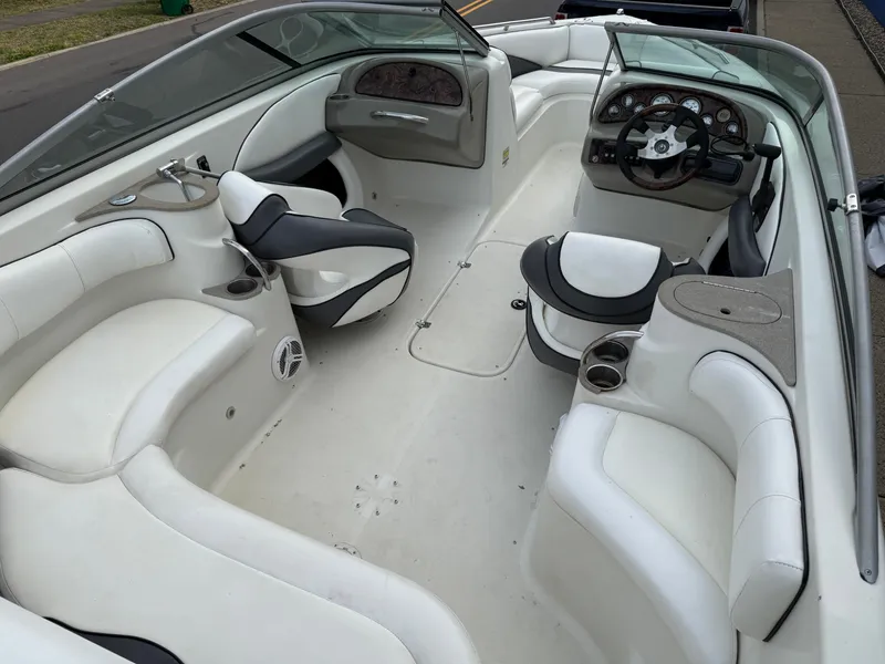 Slide: The Image of Interior of a 2007 Caravelle 237 LS Bowrider boat, white upholstery. - 2