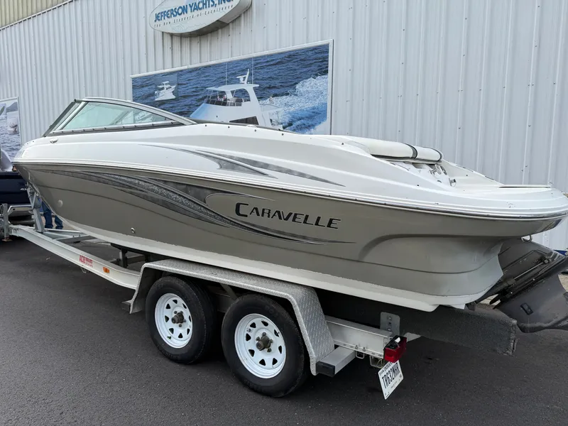 Slide: The Image of 2007 Caravelle 237 LS Bowrider on trailer outside yacht dealership. - 21