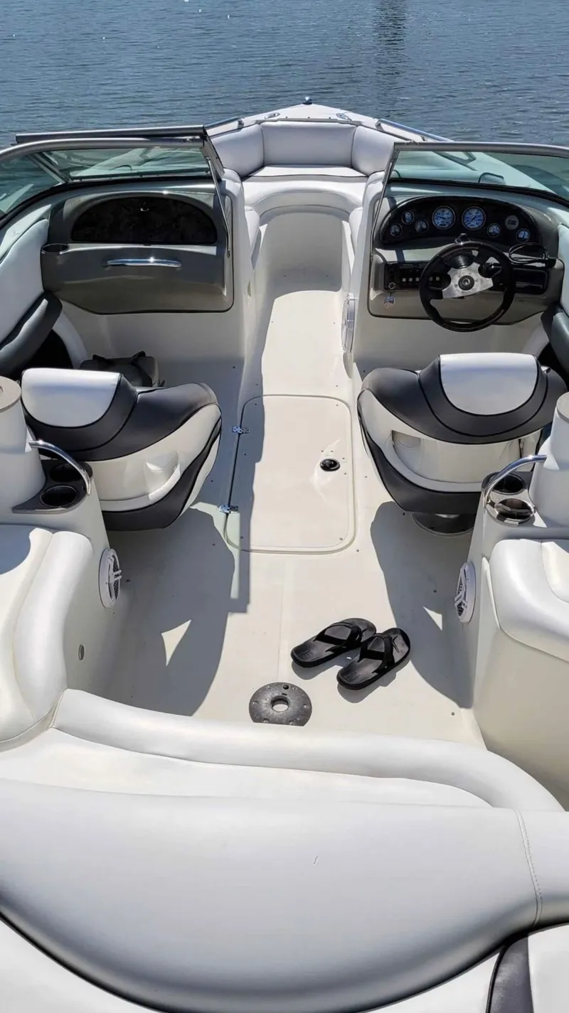 Slide: The Image of Interior of a 2007 Caravelle 237 LS Bowrider boat on the water. - 24
