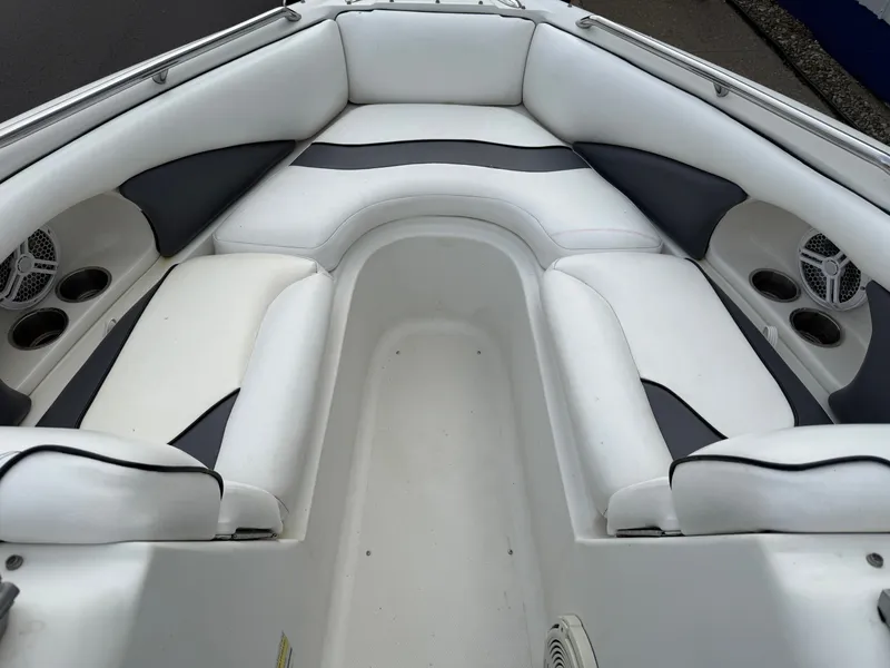 Slide: The Image of Interior of a 2007 Caravelle 237 LS Bowrider boat, white upholstery. - 3