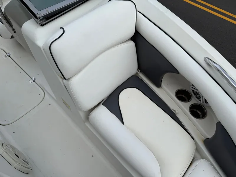 Slide: The Image of Interior of a 2007 Caravelle 237 LS Bowrider boat with white seating. - 5