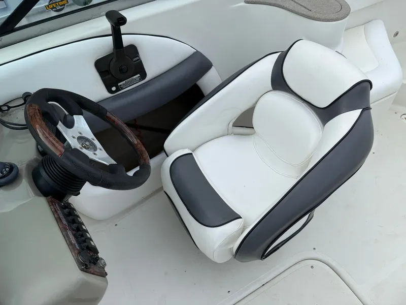 Slide: The Image of Interior of 2007 Caravelle 237 LS Bowrider with steering wheel and seat. - 7