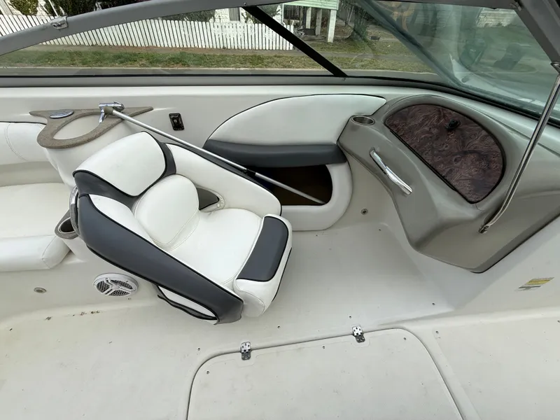 Slide: The Image of Interior of a 2007 Caravelle 237 LS Bowrider boat with white seating. - 9