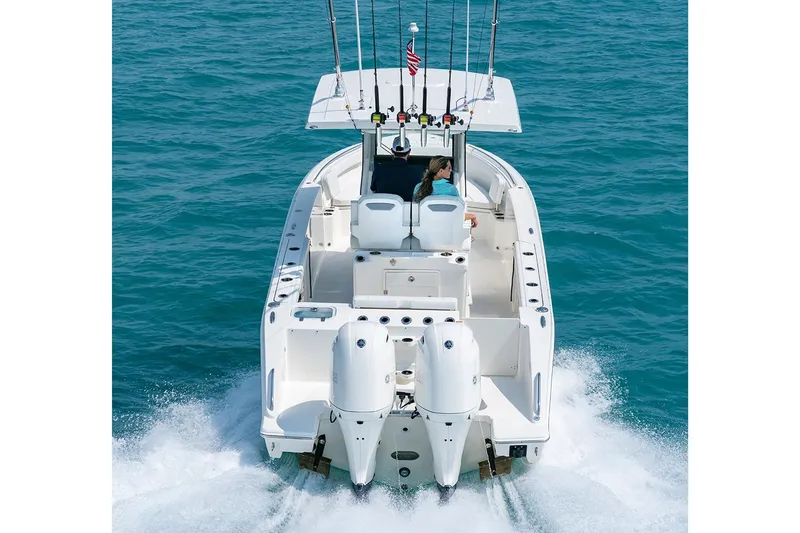 Slide: The Image of Manufacturer Provided Image: 2022 Pursuit S 268 Sport boat cruising on open water. - 8