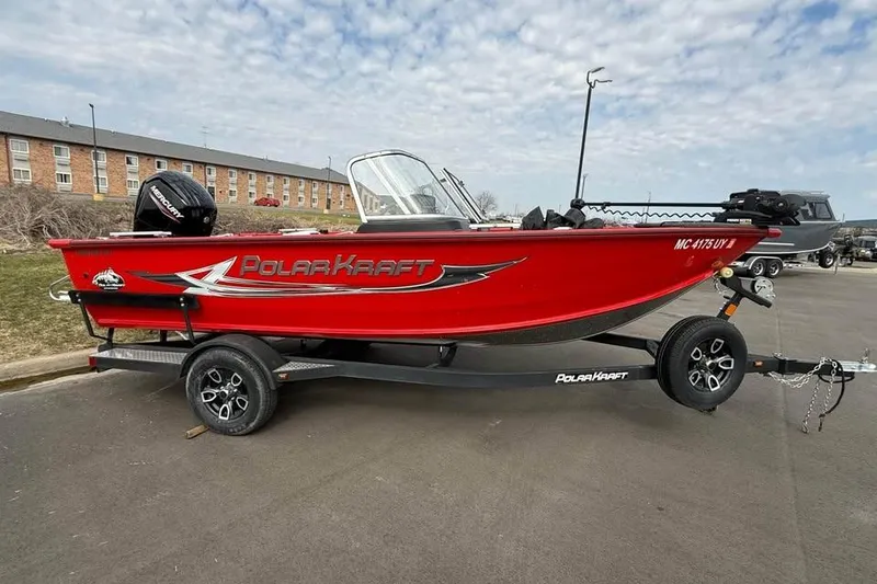The Image of 2023 Polar Kraft Frontier 179 WT boat in vibrant red on a trailer. - 0
