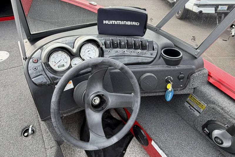 Slide: The Image of 2023 Polar Kraft Frontier 179 WT dashboard with steering wheel and Humminbird device. - 14