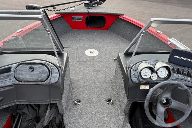 Slide: The Image of 2023 Polar Kraft Frontier 179 WT boat interior with steering console and dashboard. - 16