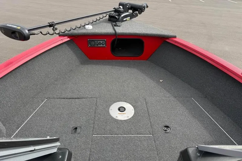 Slide: The Image of 2023 Polar Kraft Frontier 179 WT boat interior with trolling motor and carpeted deck. - 17