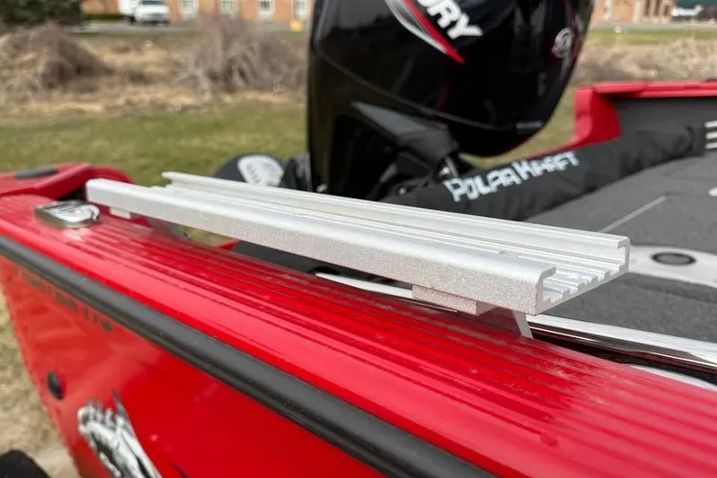 Slide: The Image of 2023 Polar Kraft Frontier 179 WT boat detail with red exterior and Mercury engine. - 20