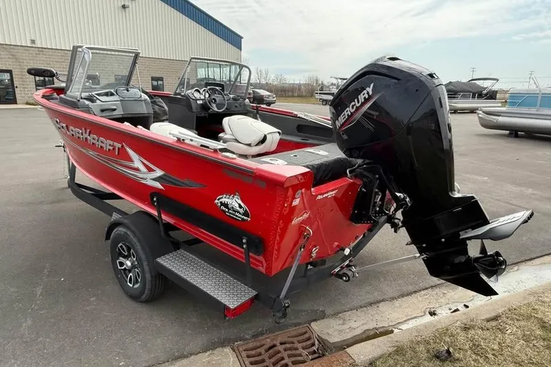 Slide: The Image of 2023 Polar Kraft Frontier 179 WT boat with Mercury outboard motor, parked outdoors. - 4