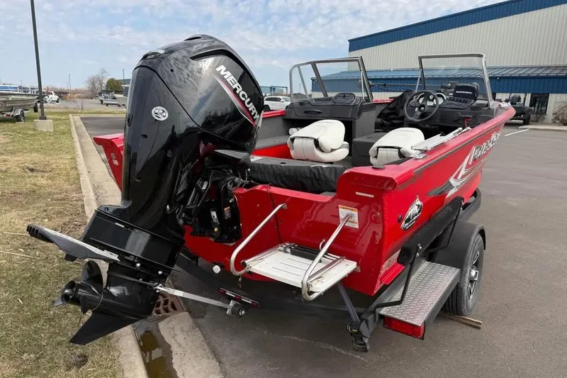 Slide: The Image of 2023 Polar Kraft Frontier 179 WT boat with Mercury outboard motor, parked outdoors. - 6