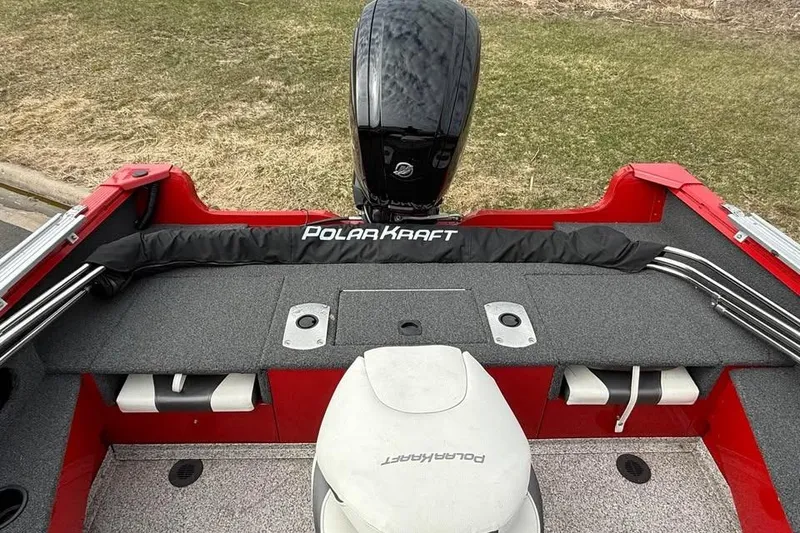 Slide: The Image of 2023 Polar Kraft Frontier 179 WT boat interior with motor and seating. - 7