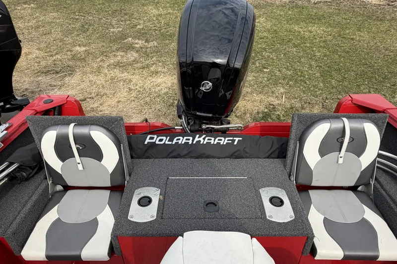 Slide: The Image of 2023 Polar Kraft Frontier 179 WT boat interior with dual seats and motor. - 8