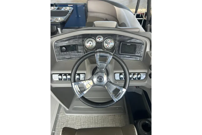 Slide: The Image of Steering console of 2022 Avalon 2485 LSZ QL boat with modern controls and gauges. - 6