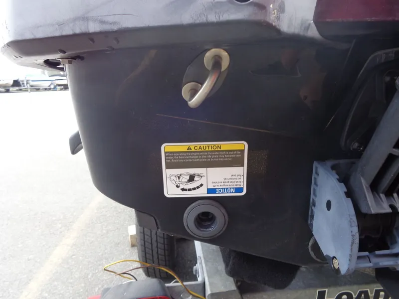 Slide: The Image of Rear view of 2015 Sea-Doo GTR™ 215 with caution label. - 18