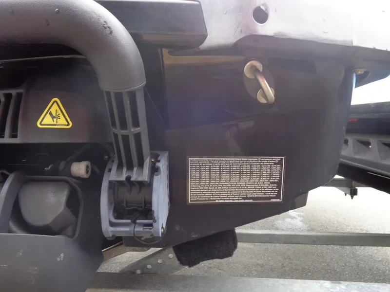 Slide: The Image of Close-up of 2015 Sea-Doo GTR™ 215 engine with warning label. - 19