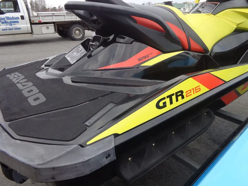 Slide: The Image of 2015 Sea-Doo GTR 215 jet ski, yellow and black, side view. - 20