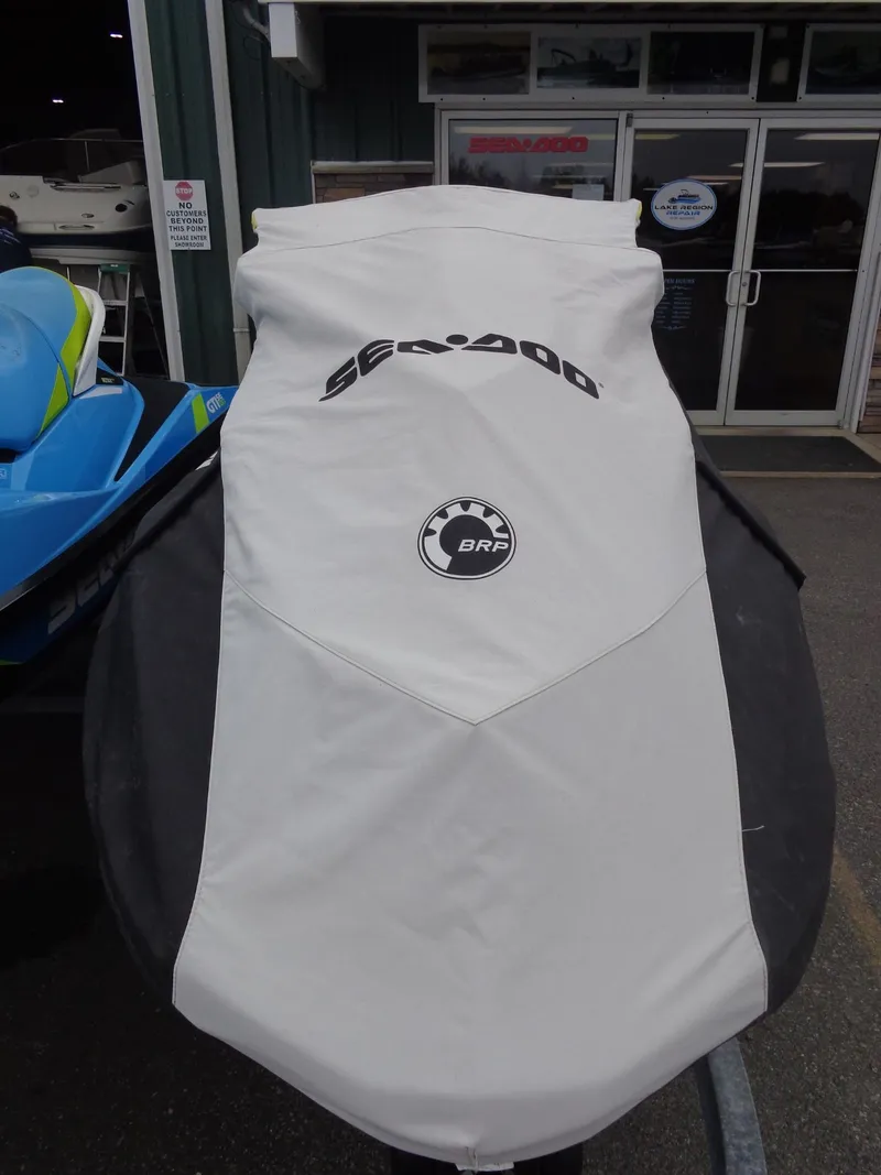 Slide: The Image of Covered 2015 Sea-Doo GTR™ 215 jet ski outside a store. - 27