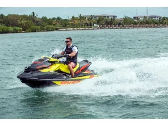 Slide: The Image of Man riding 2015 Sea-Doo GTR™ 215 jet ski on water. - 36