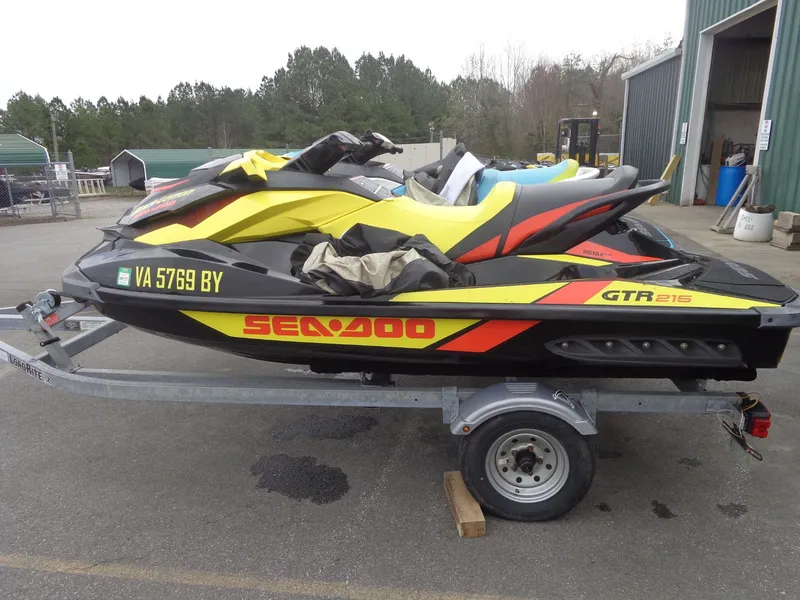 Slide: The Image of 2015 Sea-Doo GTR 215 jet ski on trailer, yellow and black. - 5