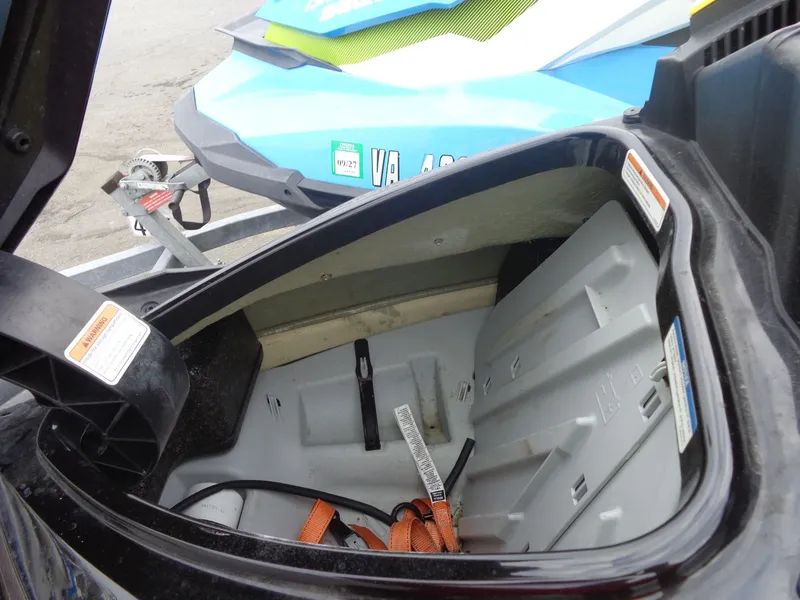 Slide: The Image of 2015 Sea-Doo GTR 215 storage compartment with open lid. - 7