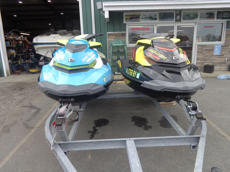The Image of Two 2015 Sea-Doo GTI SE 130 jet skis on a trailer. - 1