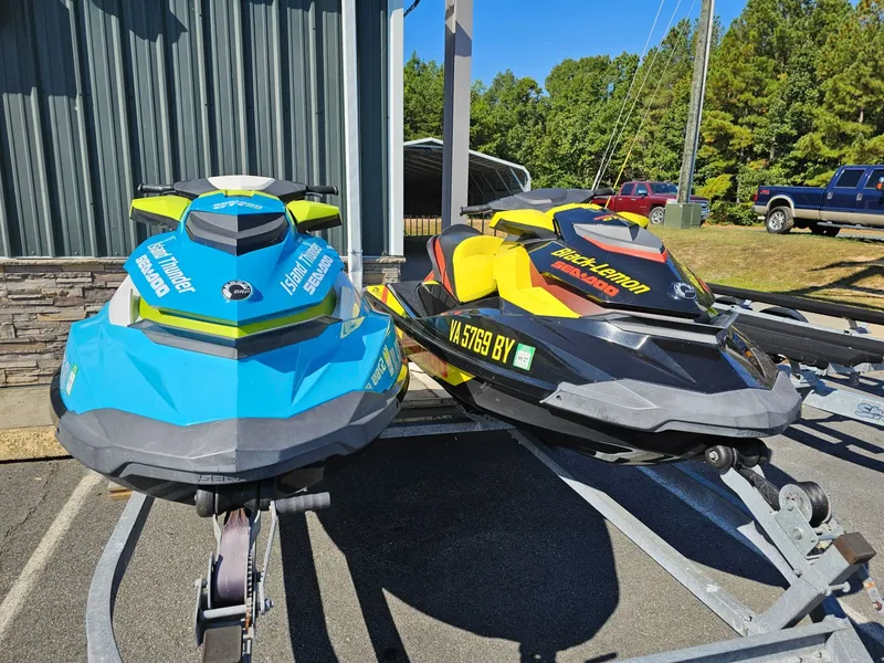 Slide: The Image of Two Sea-Doo GTI SE 130 jet skis, blue and yellow, on a trailer. - 22
