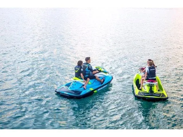 Slide: The Image of Two Sea-Doo GTI SE 130 jet skis on water, 2015 model. - 29