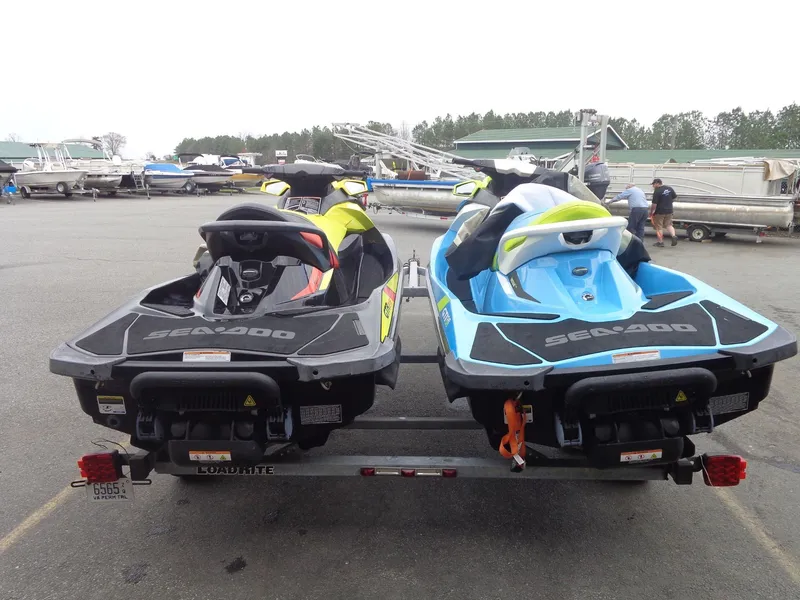 Slide: The Image of Two 2015 Sea-Doo GTI SE 130 jet skis on a trailer. - 3