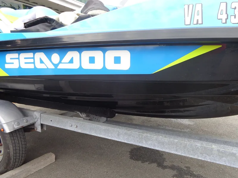 Slide: The Image of 2015 Sea-Doo GTI SE 130 on trailer, blue and black body. - 8