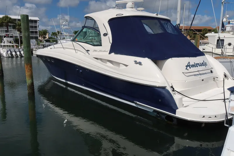 The Image of 2005 Sea Ray 500 Sundancer yacht docked in a marina under a blue sky. - 0