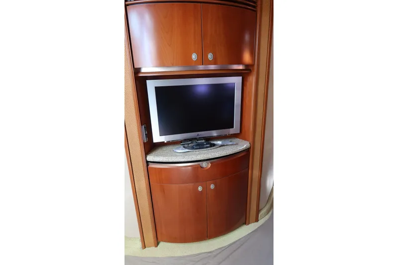 Slide: The Image of Flat-screen TV in 2005 Sea Ray 500 Sundancer yacht's wooden cabinet interior. - 16