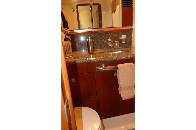 Slide: The Image of Luxurious bathroom interior of 2005 Sea Ray 500 Sundancer yacht with granite countertop. - 22