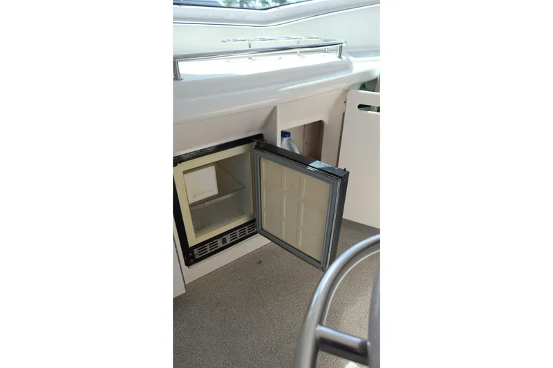 Slide: The Image of Open mini fridge on 2005 Sea Ray 500 Sundancer yacht interior. - 7