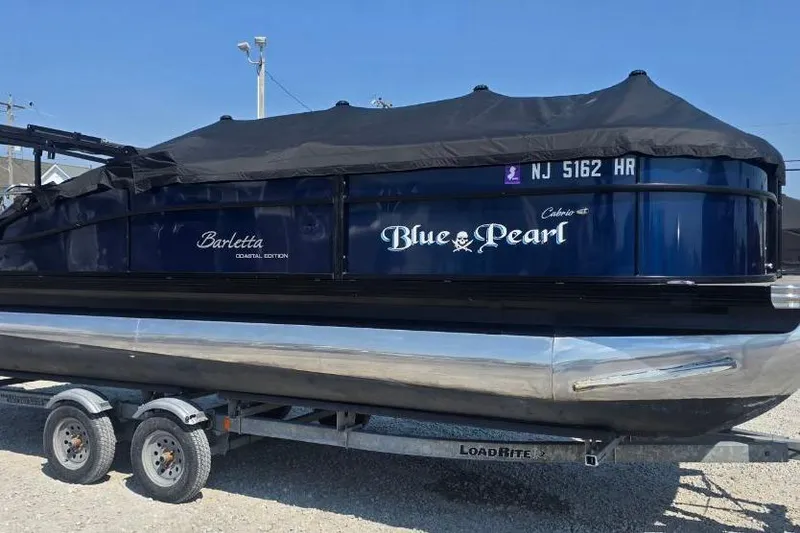 The Image of 2022 Barletta C22UC pontoon boat, "Blue Pearl," on trailer with cover. - 0