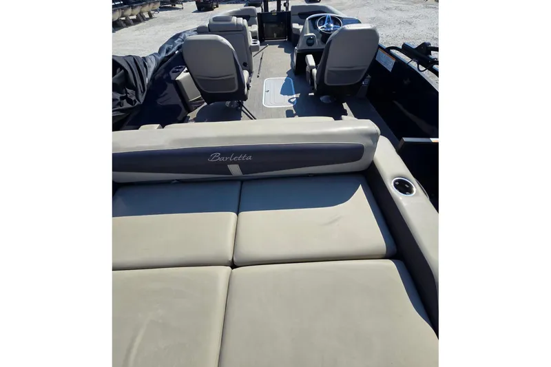 Slide: The Image of 2022 Barletta C22UC pontoon boat interior with seating and steering wheel. - 10