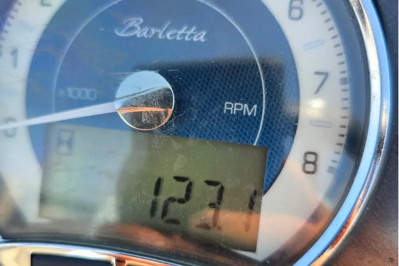 Slide: The Image of Close-up of a 2022 Barletta C22UC RPM gauge displaying 1271 RPM. - 12