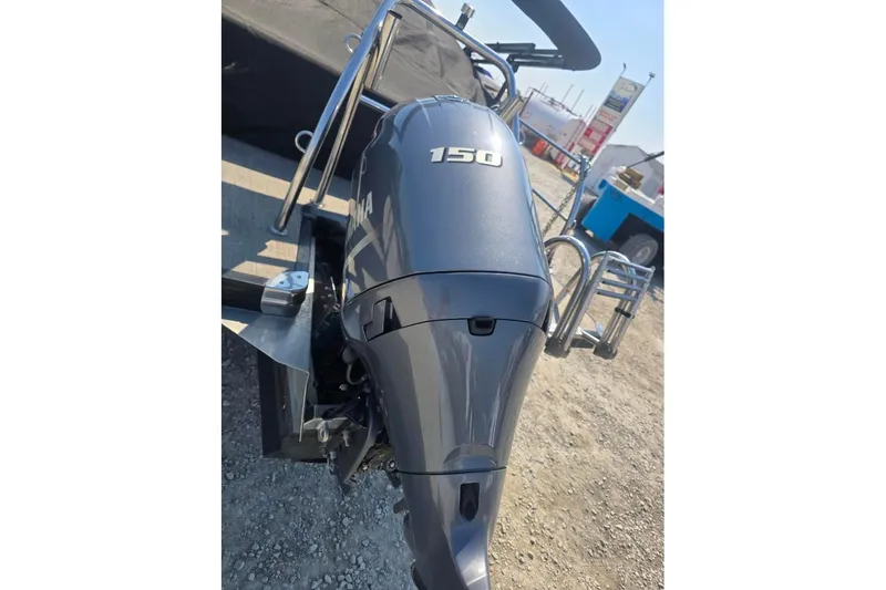 Slide: The Image of 2022 Barletta C22UC boat with a 150 horsepower Yamaha outboard motor. - 4