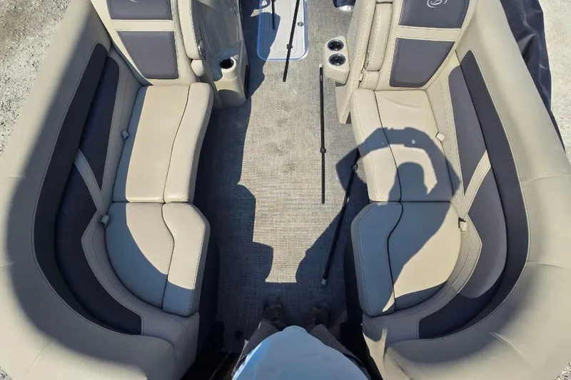 Slide: The Image of Interior of 2022 Barletta C22UC pontoon boat with beige seating and cup holders. - 6