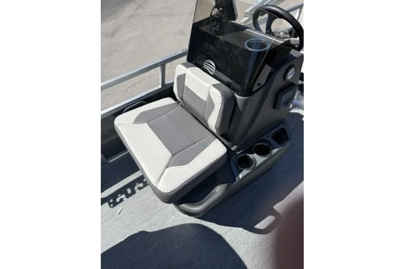 Slide: The Image of 2026 Sun Tracker Bass Buggy 16 XL Select boat seat with console and cup holders. - 5