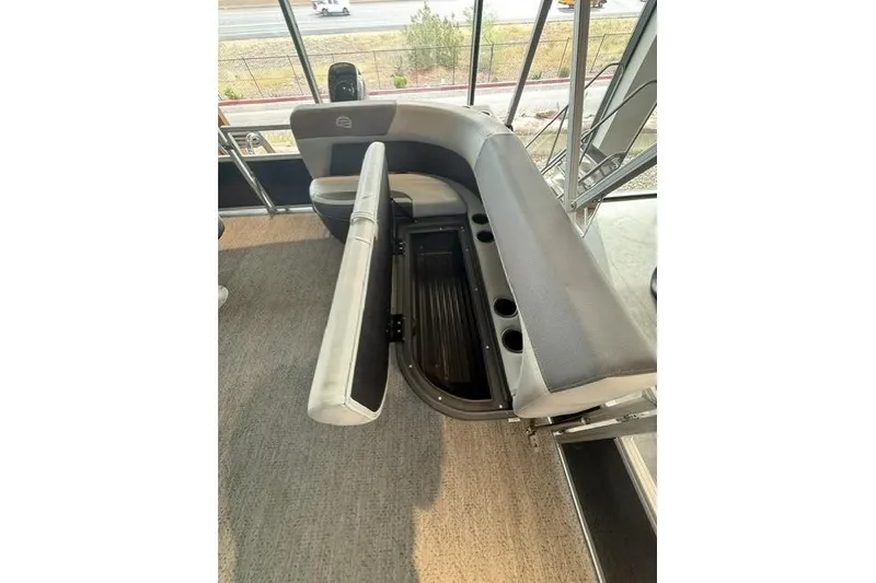 Slide: The Image of 2026 Sun Tracker Bass Buggy 16 XL Select interior seating with storage compartment. - 7