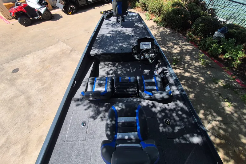 Slide: The Image of 2026 Ranger RT188 boat interior with seating and steering console. - 8