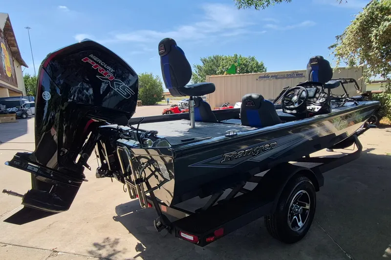 Slide: The Image of 2026 Ranger RT188 boat with Mercury Pro XS engine, parked outdoors. - 4